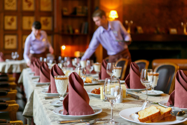 waiters-serve-table_124271-1